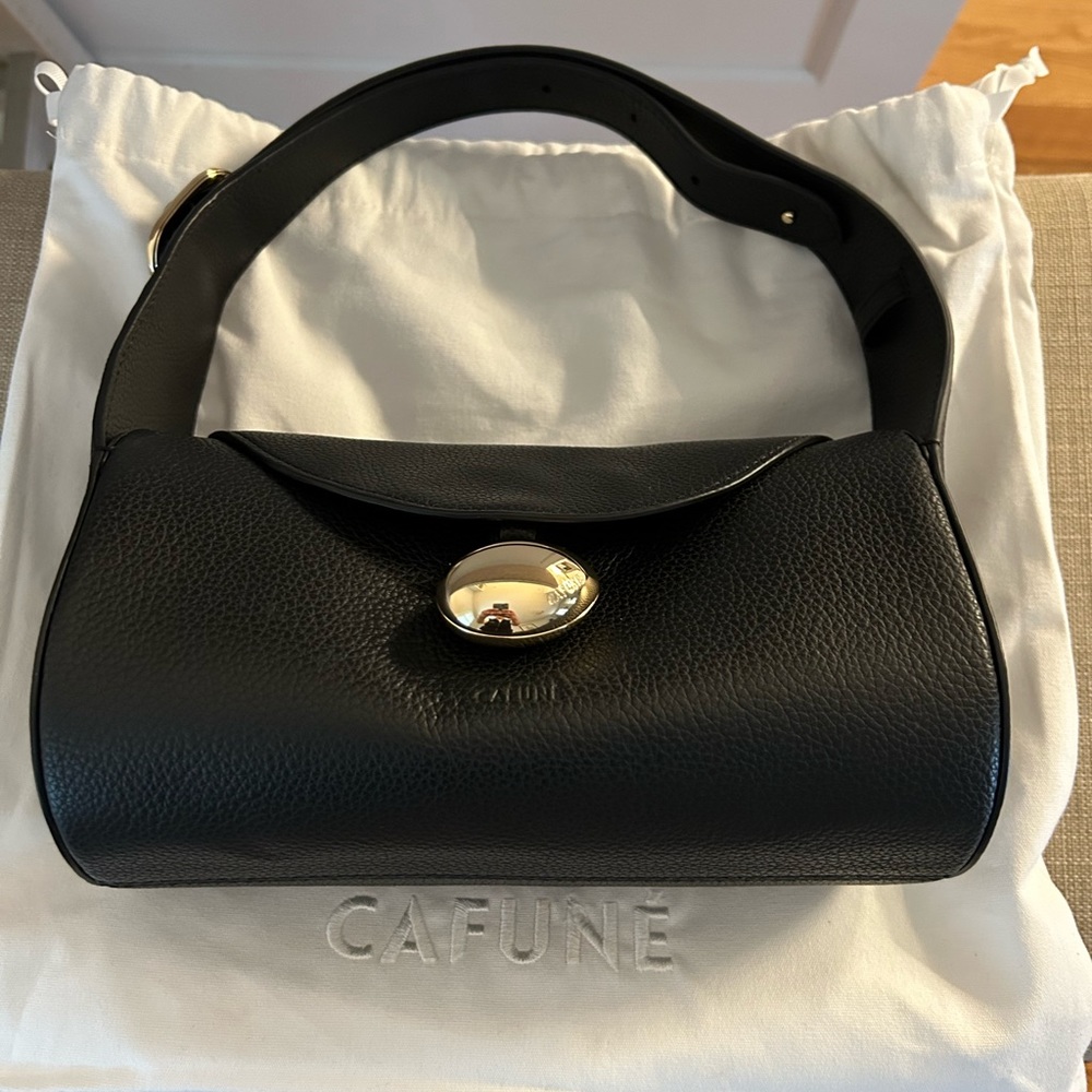 Cafune Drop Duffel black leather bag.